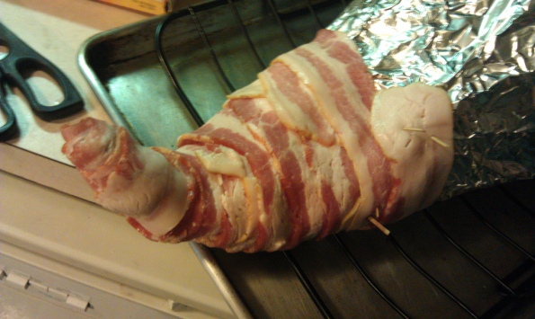 How to make a bacon cornucopia step 8: Start wrapping bacon at the tip.